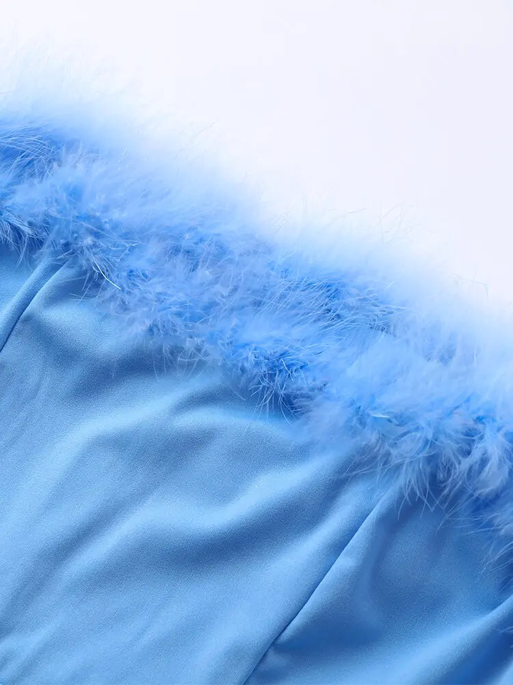 Dames jumpsuit met pailletten en verenpanelen