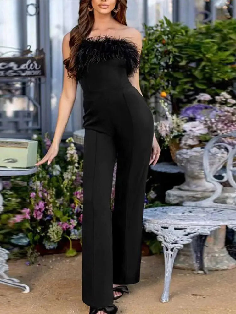 Dames jumpsuit met pailletten en verenpanelen